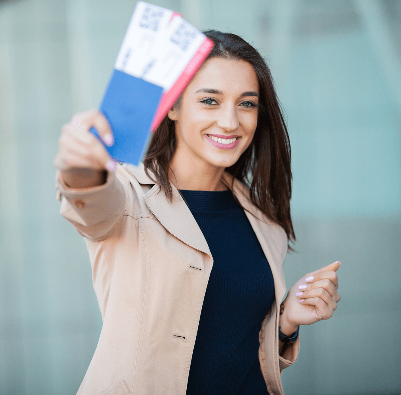Traveler holding passport and boarding passes