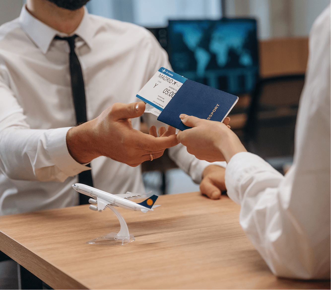 Immigration consultant handing passport to client
