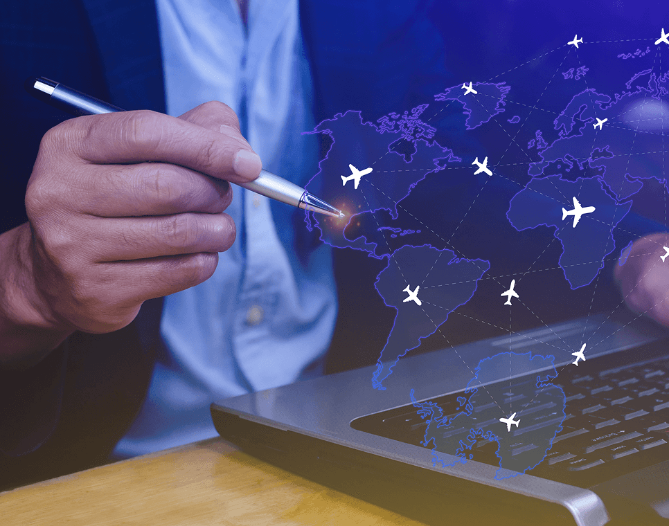 Consultant pointing at a world map on a laptop screen